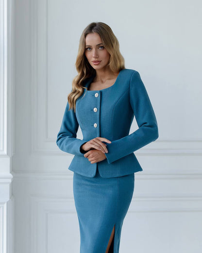 a woman in a blue dress and jacket