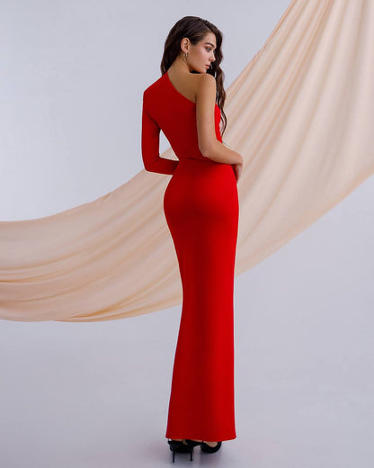 a woman in a long red dress is looking back