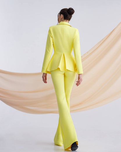 a woman in a yellow suit and black shoes