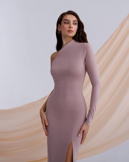a woman wearing a long sleeved dress with a slit