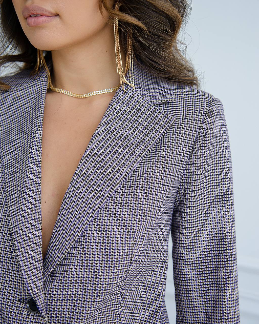 a close up of a person wearing a suit