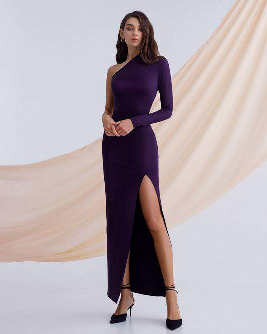a woman wearing a purple dress with a slit