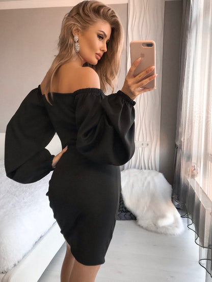 a woman taking a selfie in a black dress